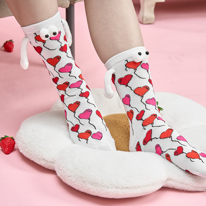 Paar Liebe Magnet hält Hände Socken