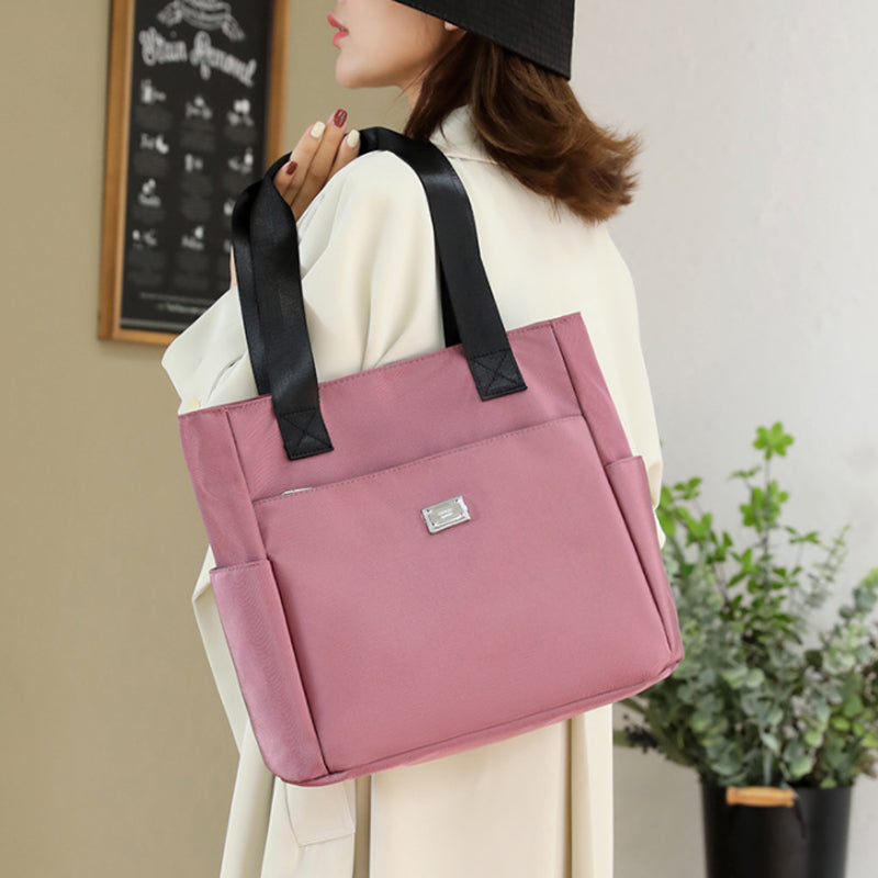 👜👜Vielseitige einfache einfarbige Nylonhandtasche mit großer Kapazität