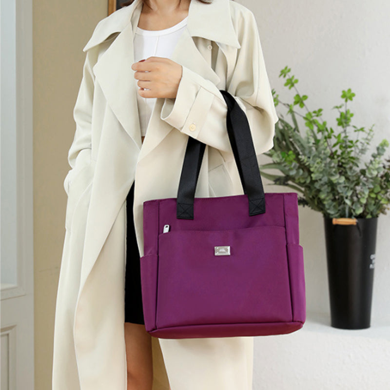 👜👜Vielseitige einfache einfarbige Nylonhandtasche mit großer Kapazität