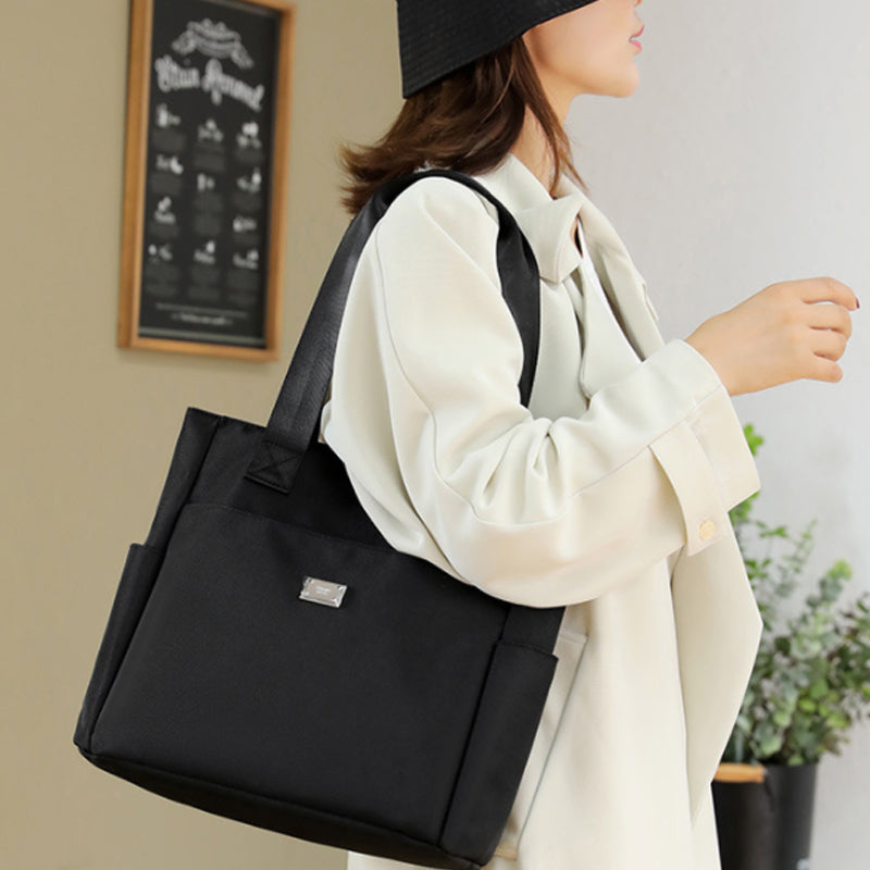 👜👜Vielseitige einfache einfarbige Nylonhandtasche mit großer Kapazität