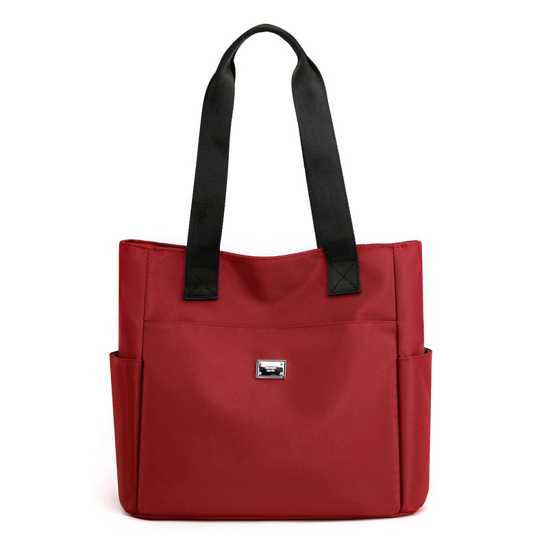 👜👜Vielseitige einfache einfarbige Nylonhandtasche mit großer Kapazität