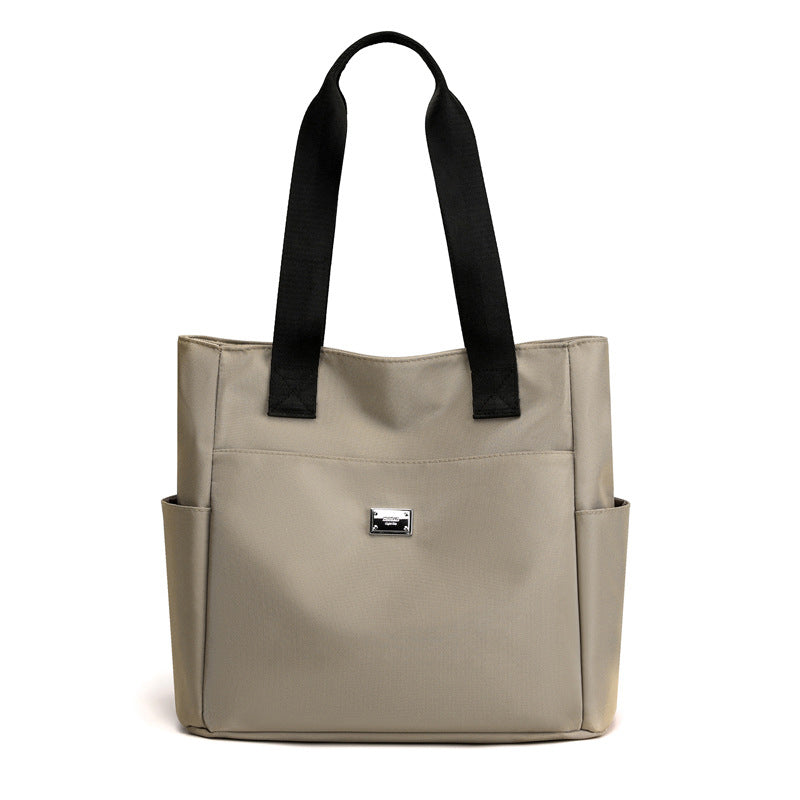 👜👜Vielseitige einfache einfarbige Nylonhandtasche mit großer Kapazität