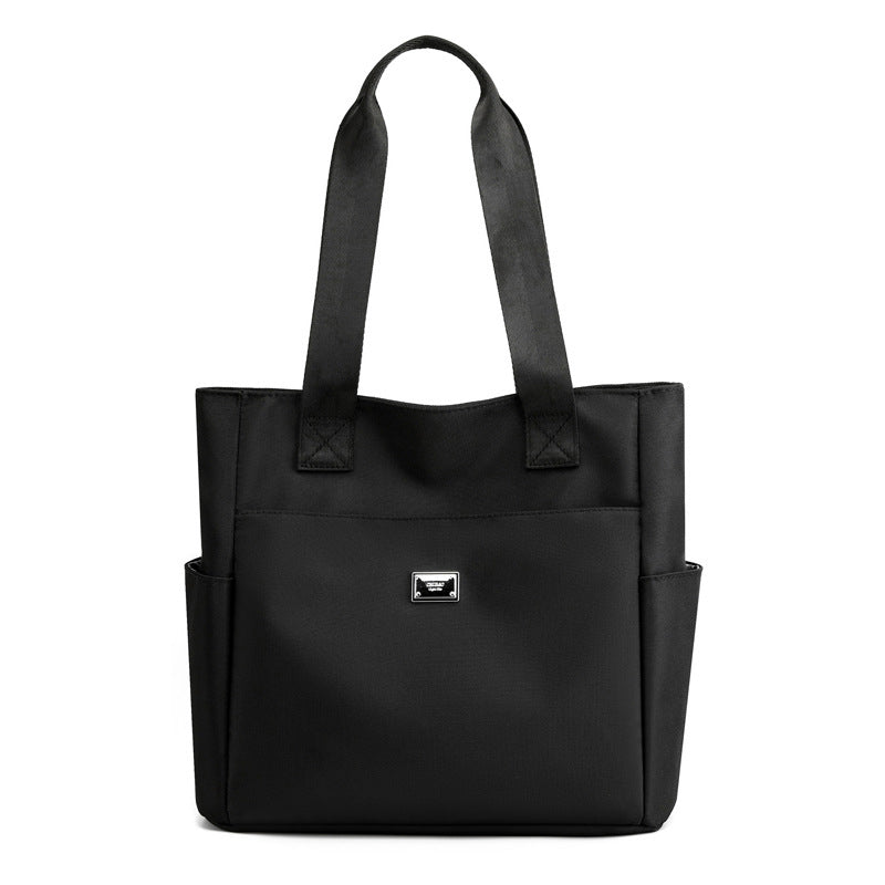 👜👜Vielseitige einfache einfarbige Nylonhandtasche mit großer Kapazität